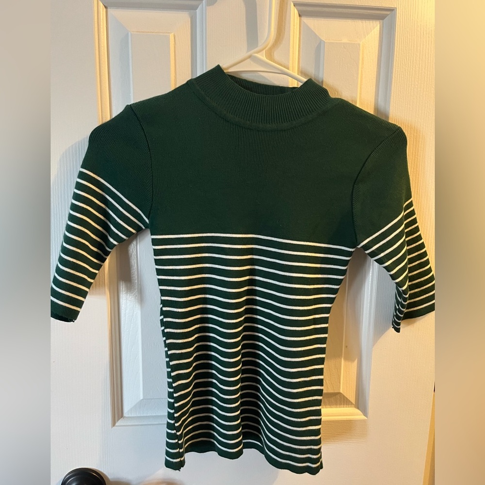 Green sweater with white stripes size XS.